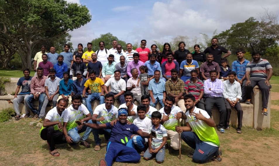 Karisakattu Poove Trust team and volunteers together at a plantation site